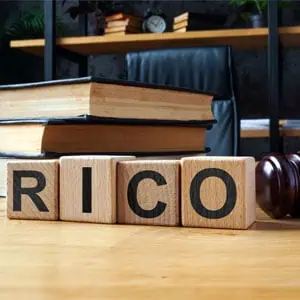 RICO spelled out in wooden blocks on a table - Wimberly Law Firm